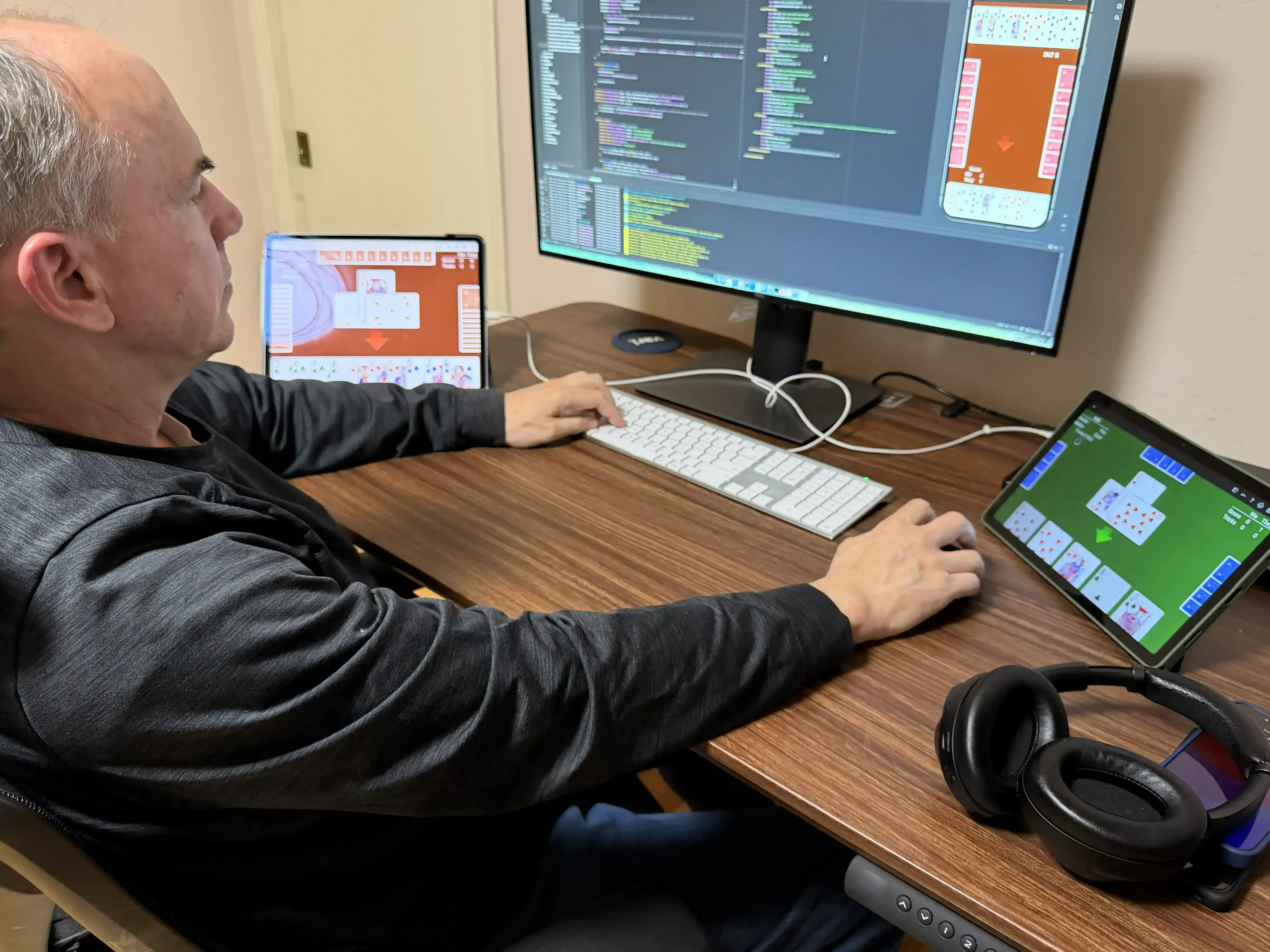 Kevin Binkley working at home on his AI-powered card games